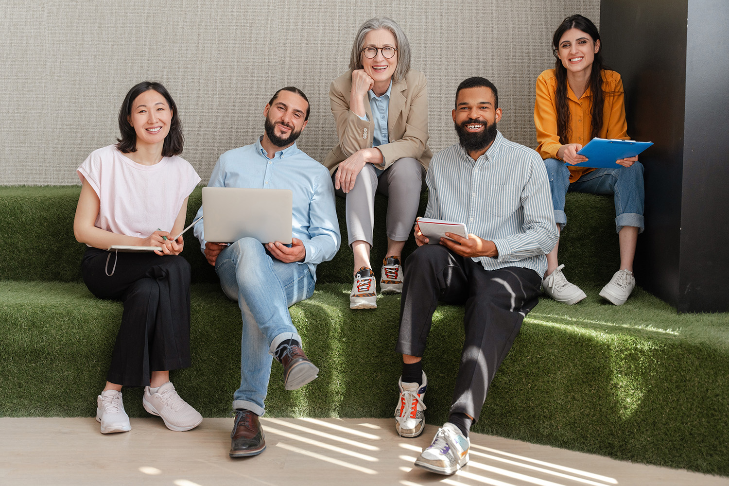 Group,Of,Professionals,From,Diverse,Backgrounds,Sitting,On,Comfortable,Couch,
